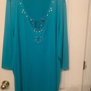 Tunic shirt turquoise color with rhinestone neckline.